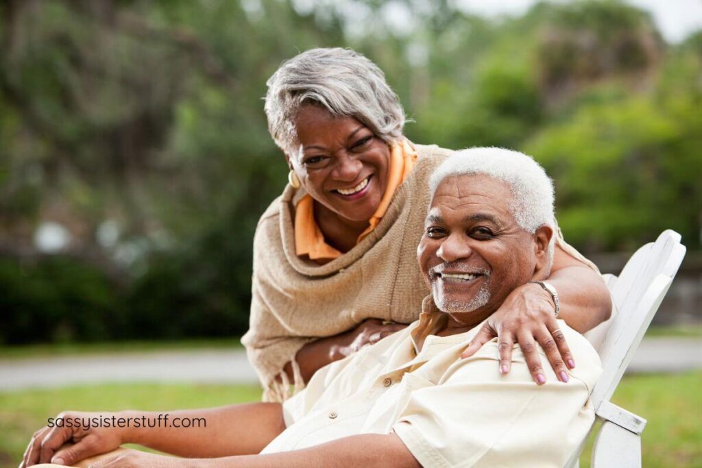 a middle aged couple reconnects with a relaxing afternoon in the park and pose for a photo.