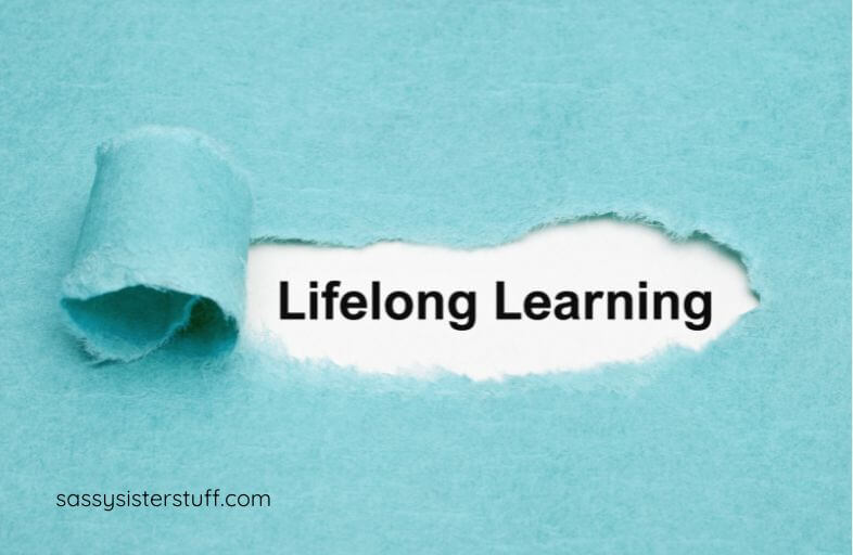 a torn paper reveals the words Lifelong Learning