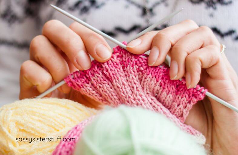 close-up of female hands knitting