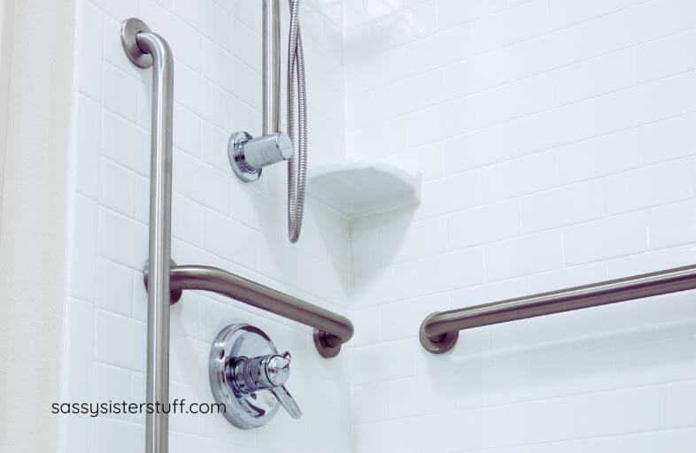 handicapped grab bars installed in a shower stall for elderly parents who need help