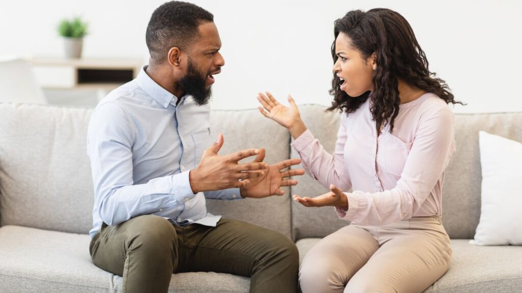 angry couple on couch