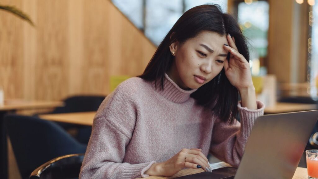 annoyed woman at computer