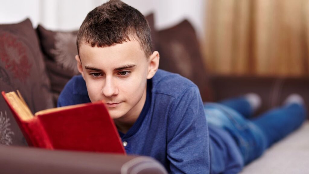 boy reading on the couch