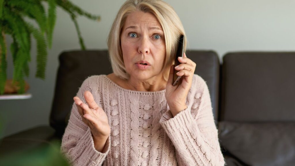 confused woman on phone