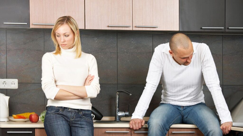 couple in kitchen upset and looking away