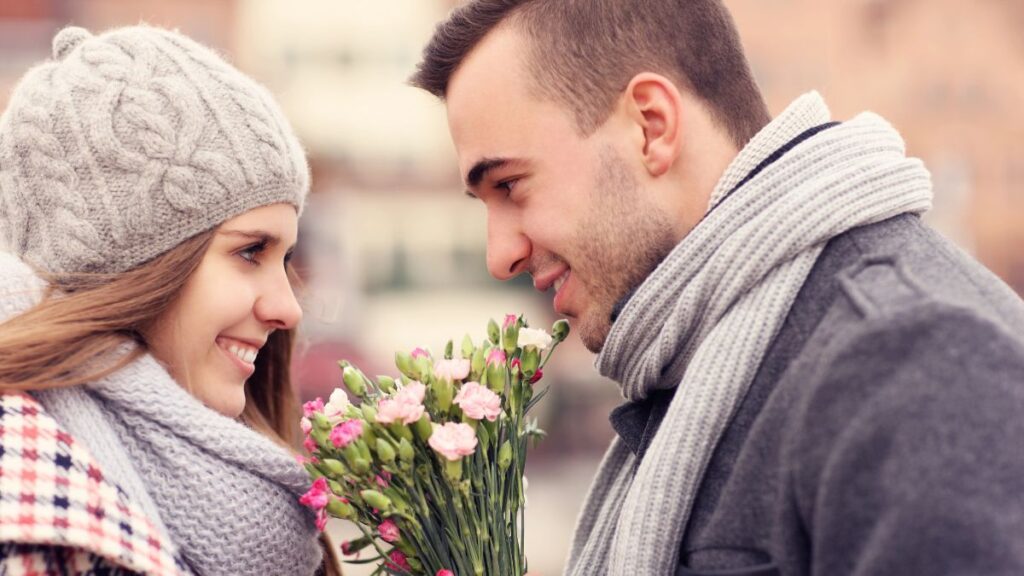 couple outside with flowers