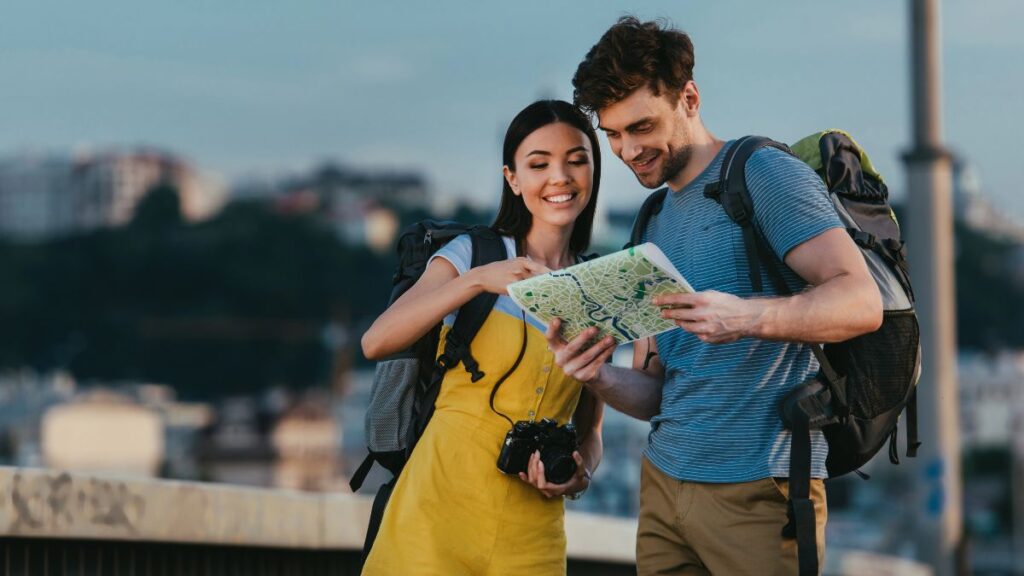 couple traveling and looking at map