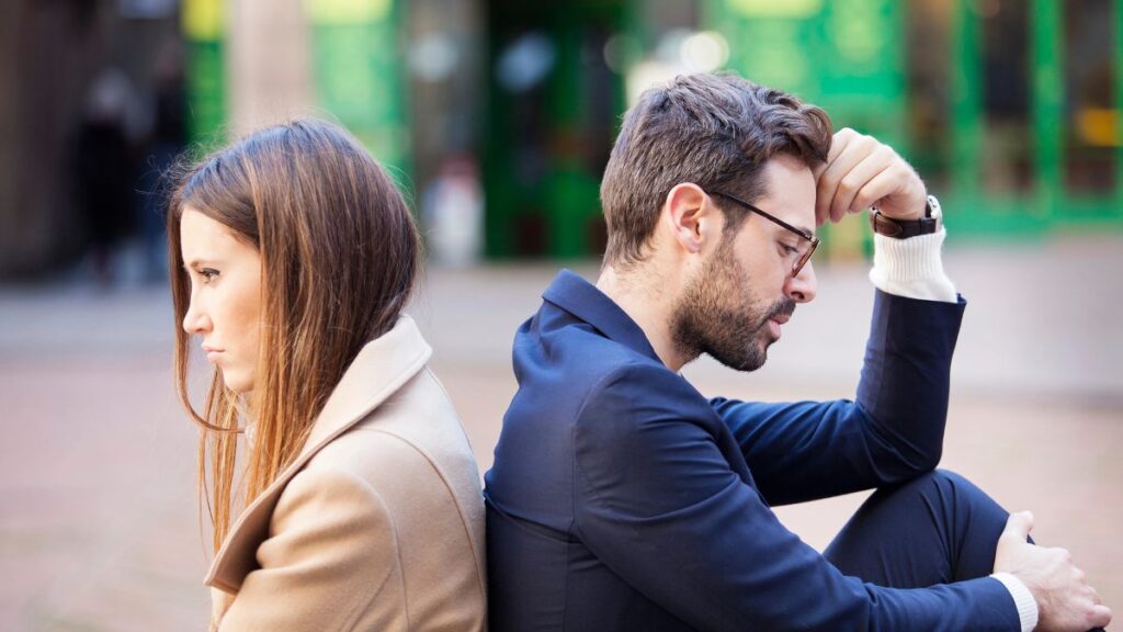 couple upset sitting back to back