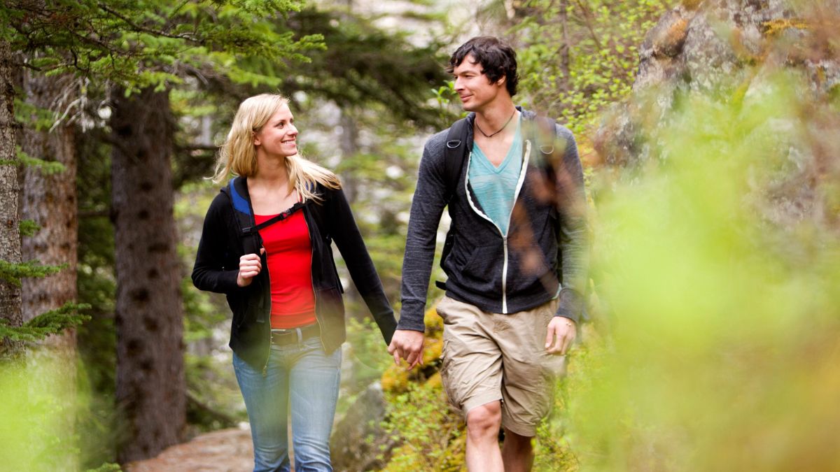 couple walking in the woods