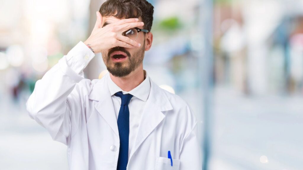 doctor covering face