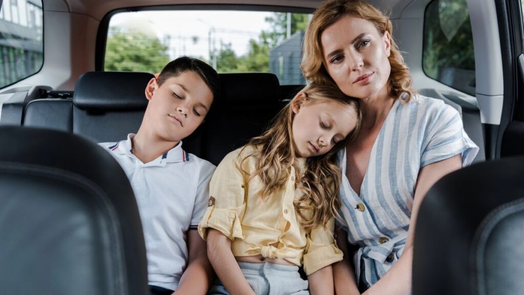 family in car kids sleeping