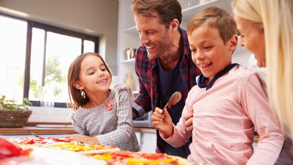 family making pizza