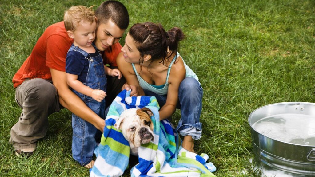 family washing dog