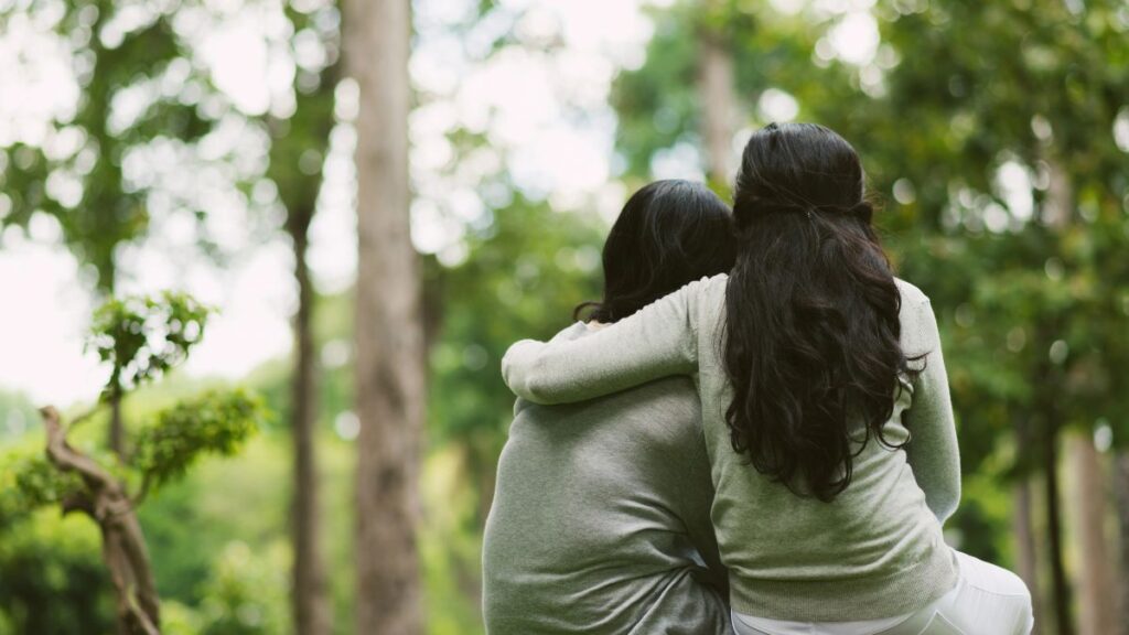 friends hugging outside