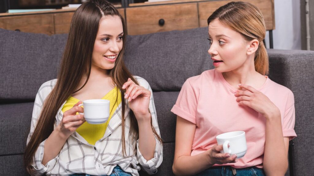 friends talking on couch with coffee