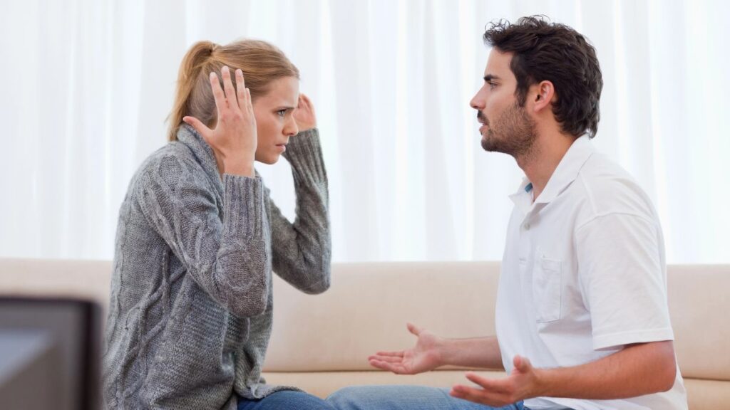 frustrated couple fighting on couch