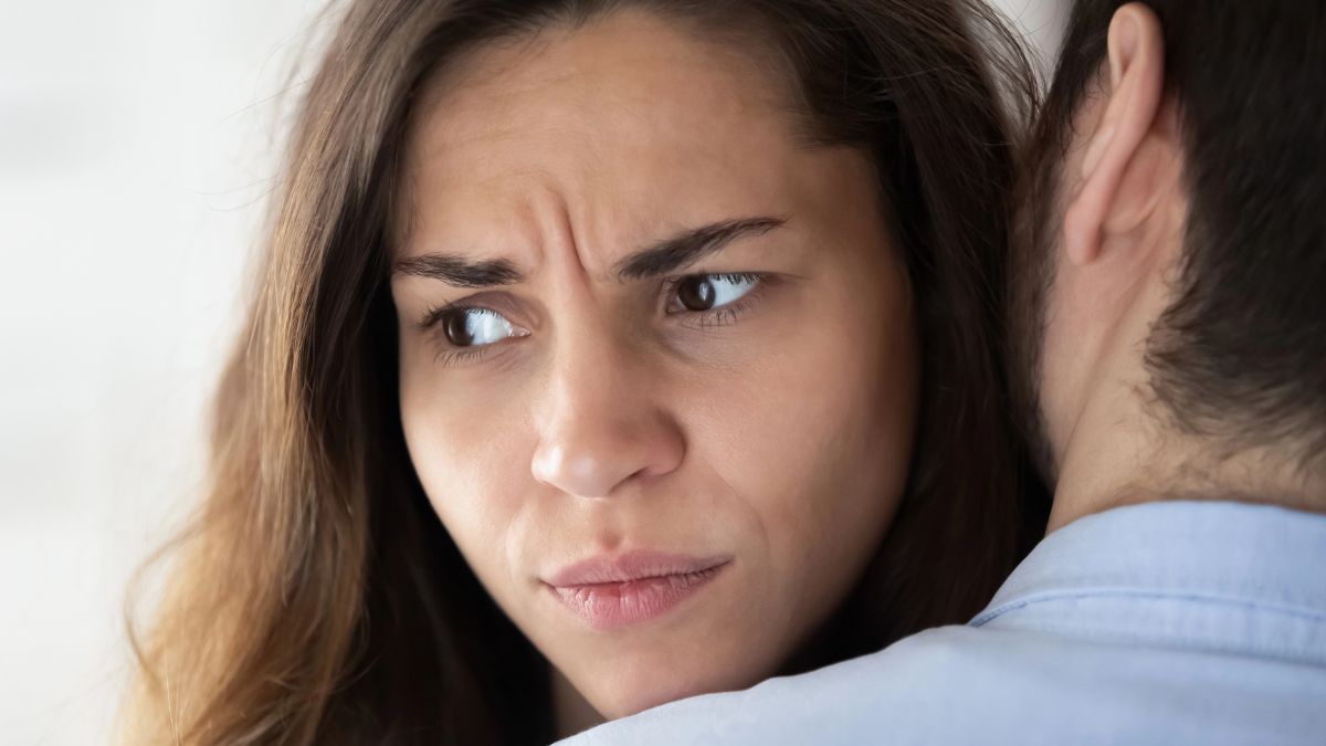 frustrated woman hugging man