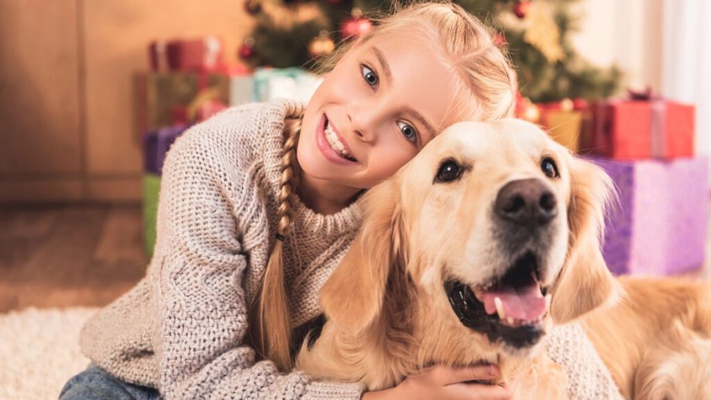 girl hugging dog