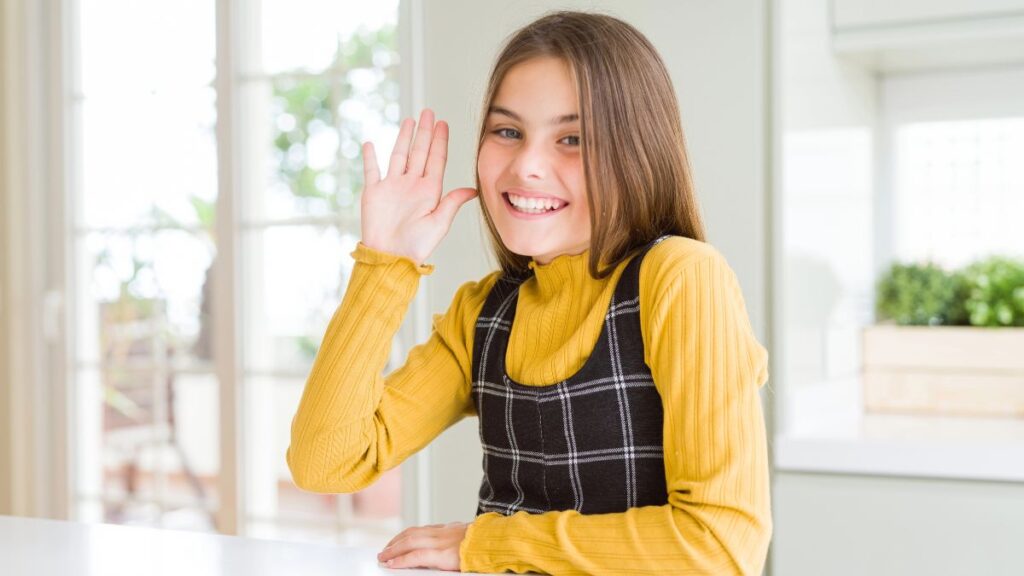 girl waving