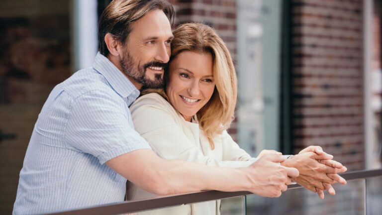 happy couple on balcony