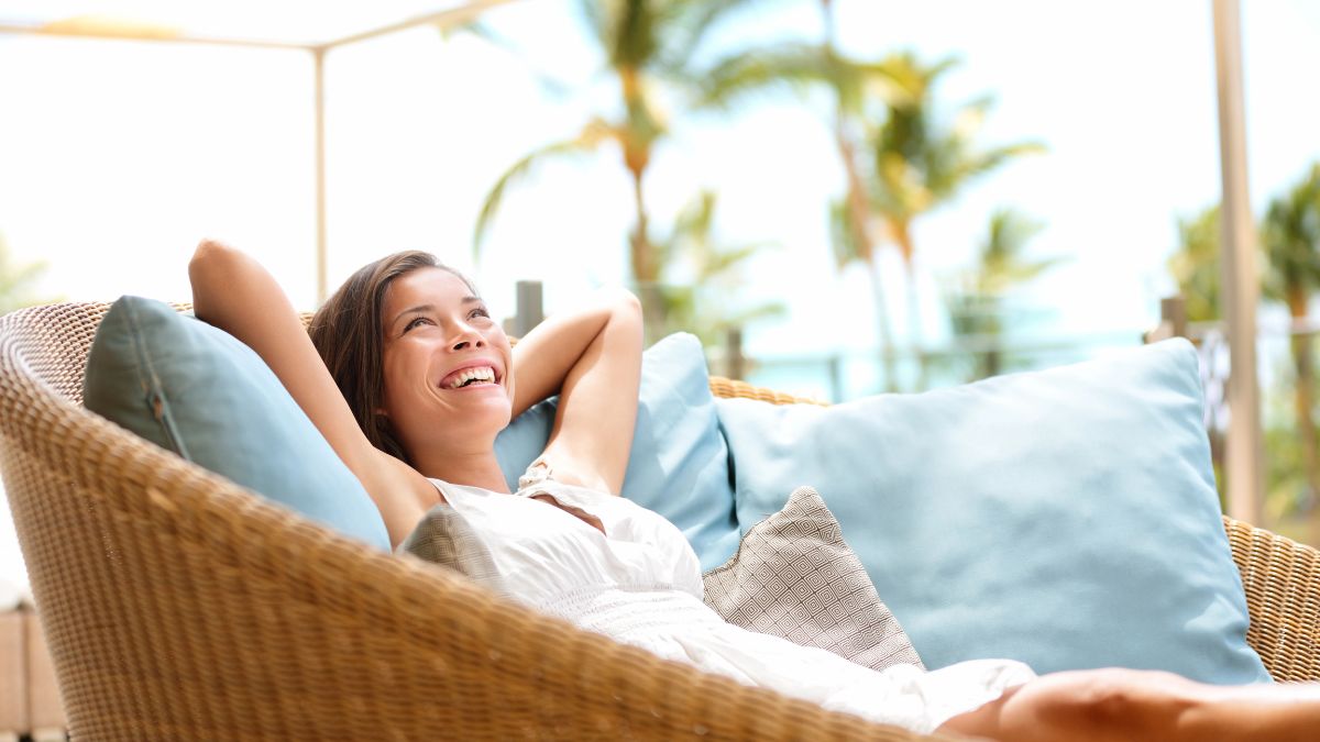 happy woman on couch outside