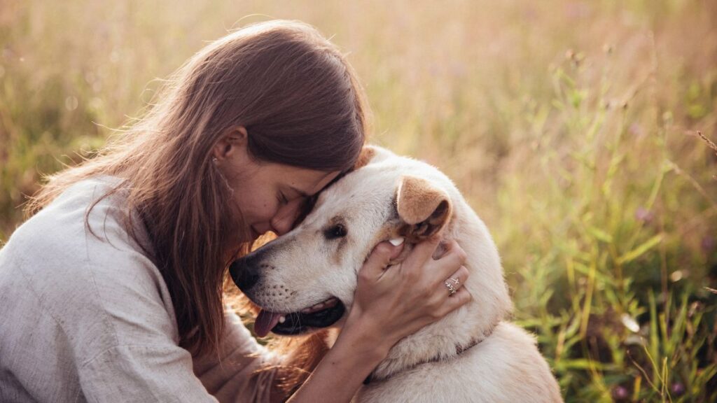 happy woman with dog outside