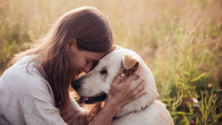 happy woman with dog outside