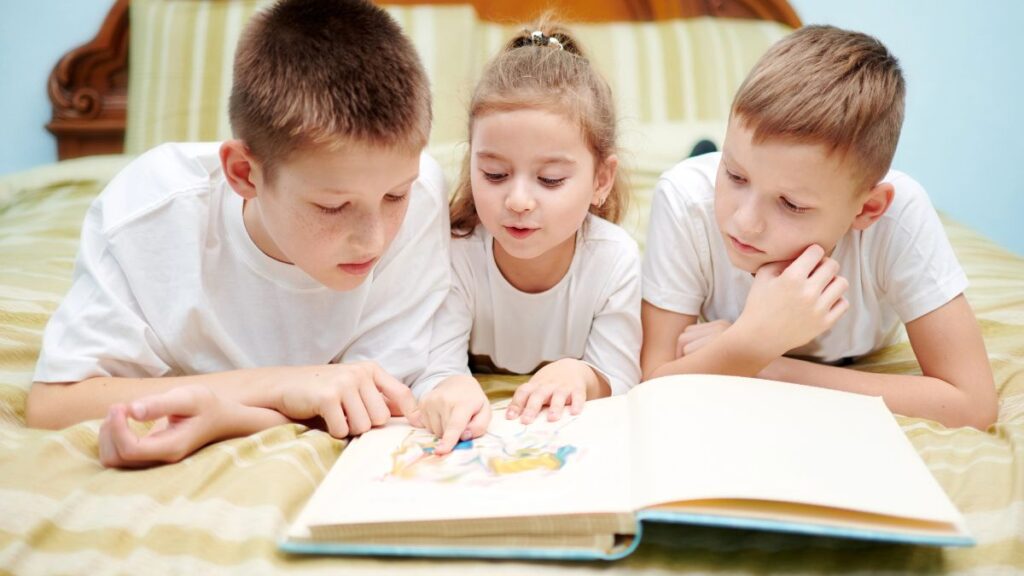 kids reading on bed