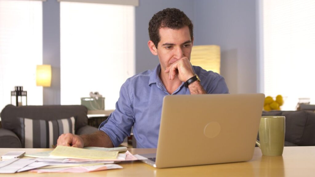 man focusing on computer