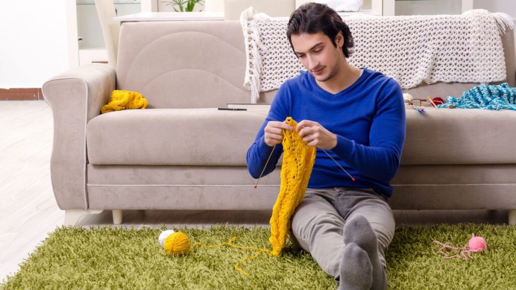 man knitting