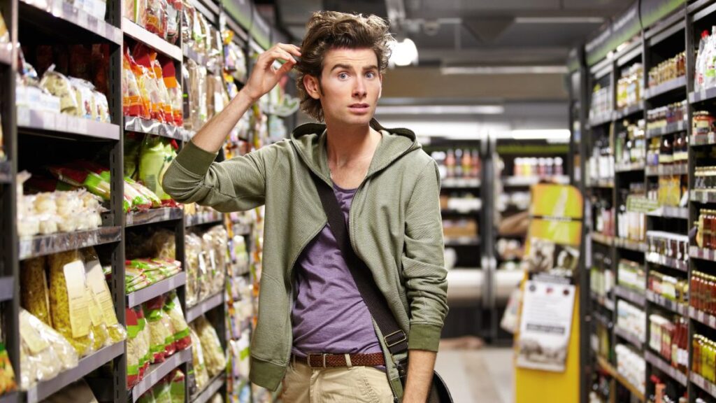 man looking confused in grocery store