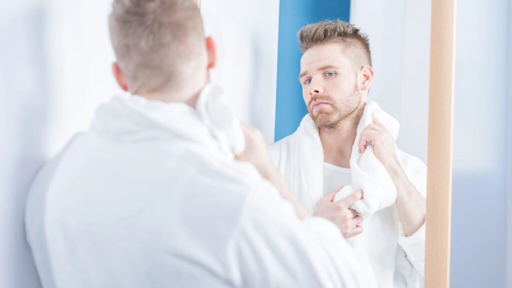 man looking in the mirror