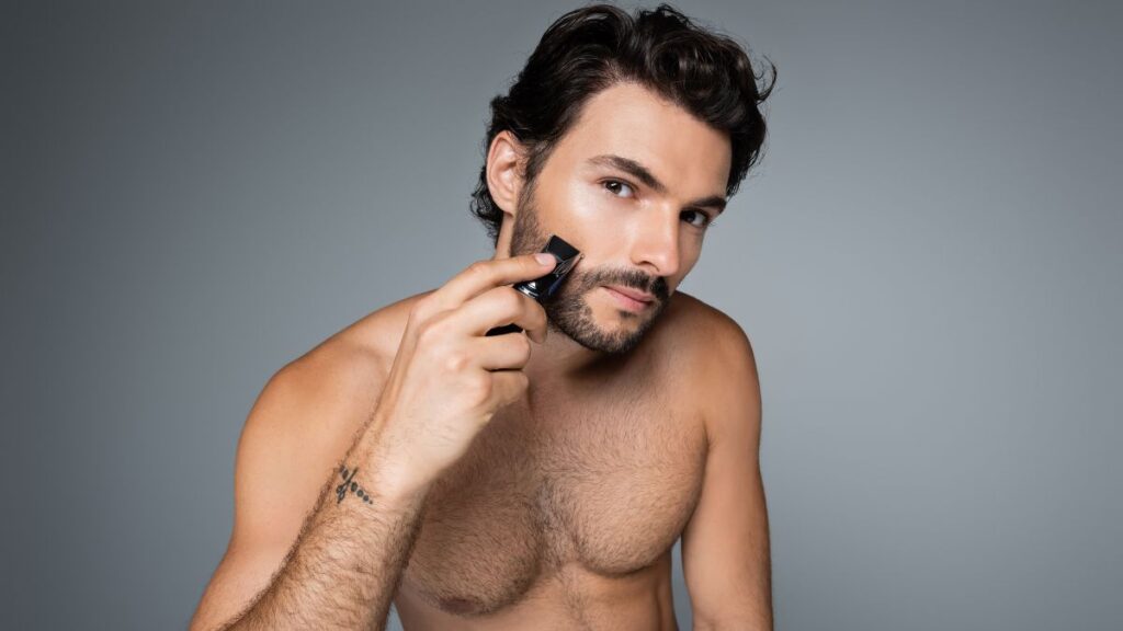 man shaving with Electric Razor