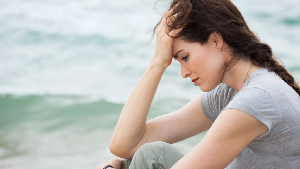 stressed woman by the water