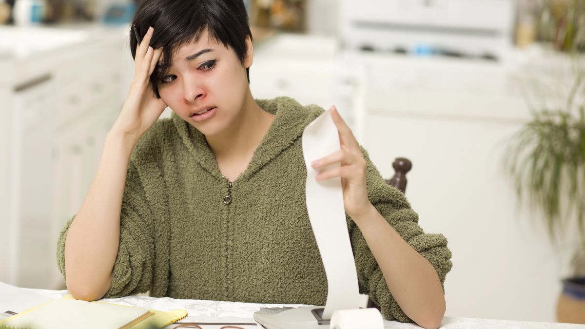 stressed woman doing bills