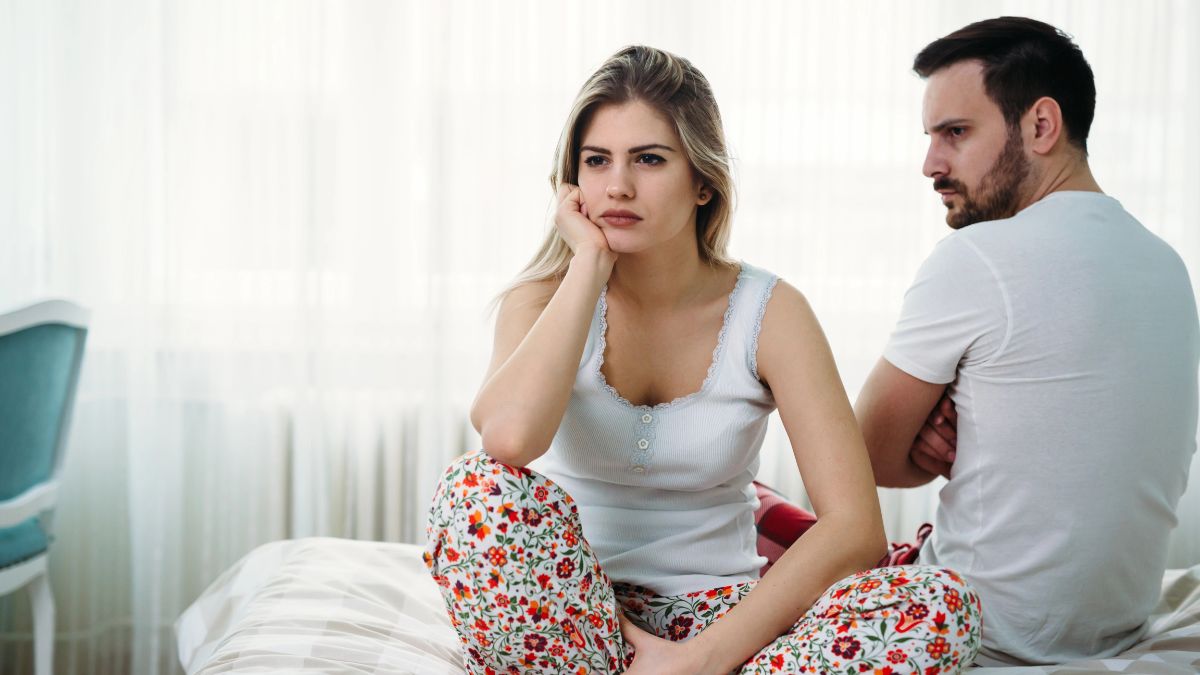 upset couple on bed