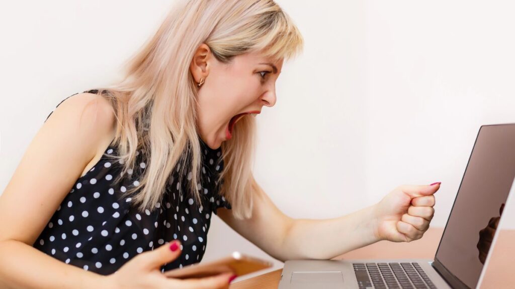 upset woman at computer