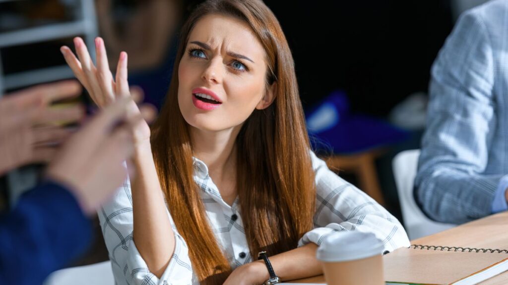 upset woman at table