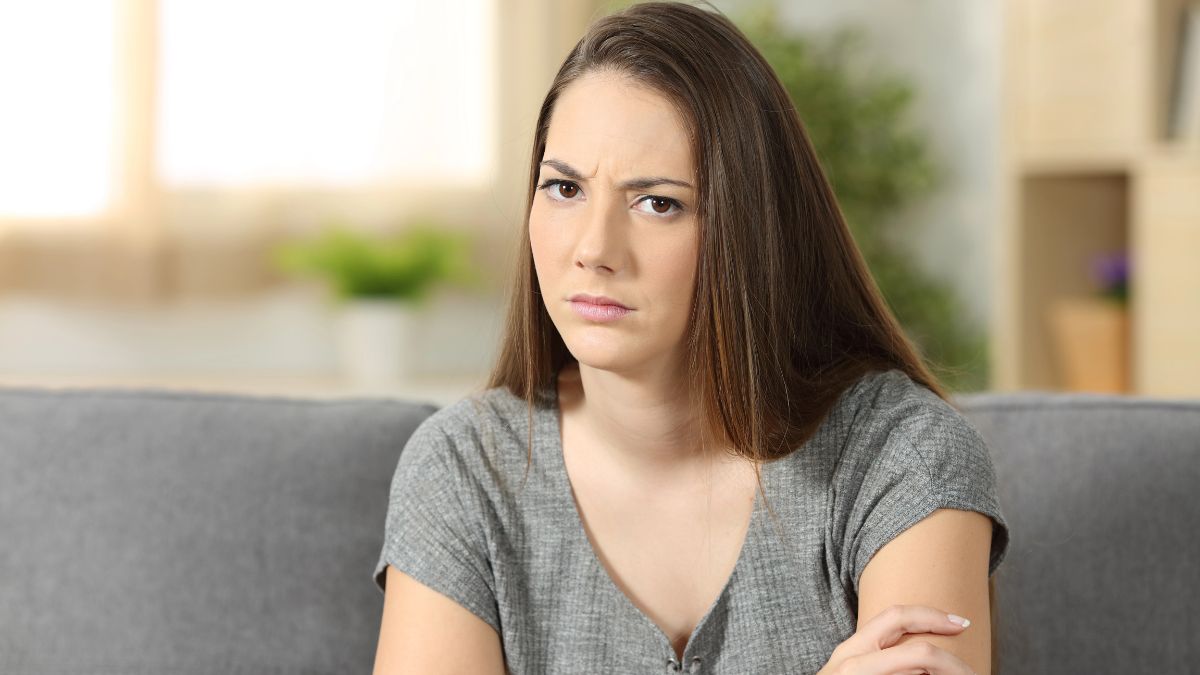 upset woman on couch