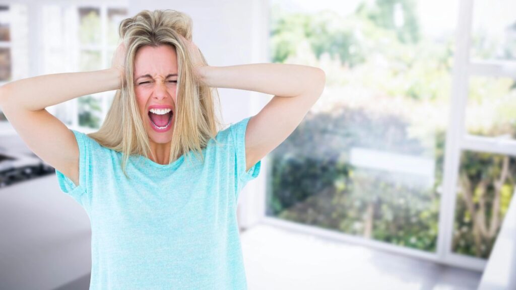 upset woman with hands in hair