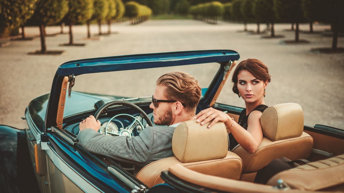 wealthy couple in car