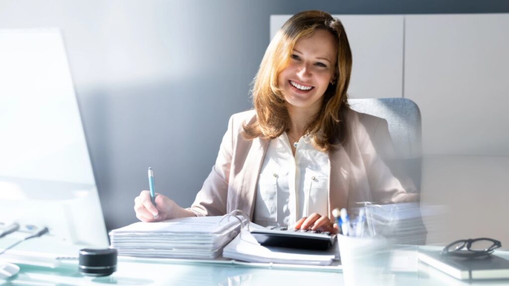 woman at desk doing bills