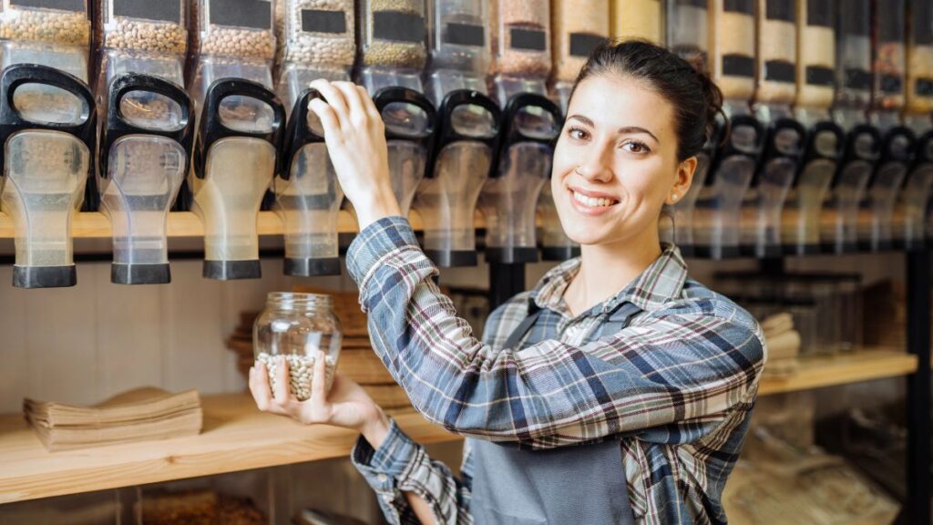 woman buying grains in grocery store