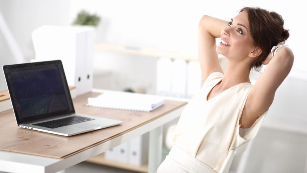 woman daydreaming at desk