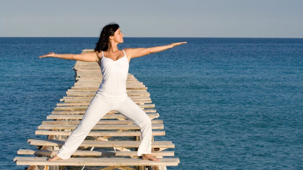 woman doing yoga on deck