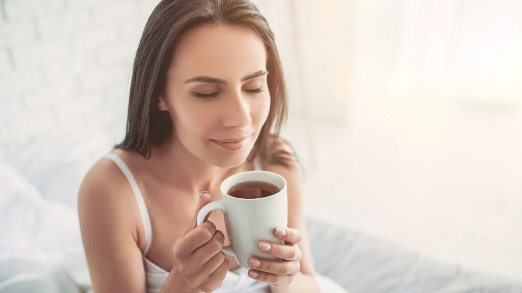 woman enjoying cup of coffee