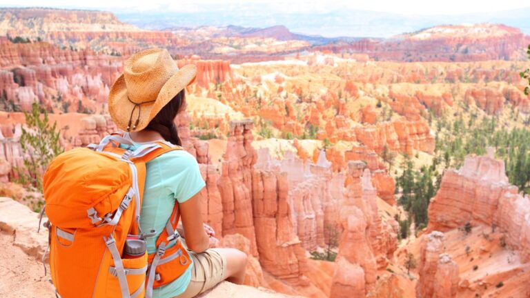 woman hiking near canyon