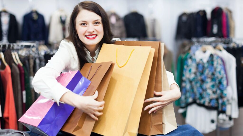 woman hugging shopping bags