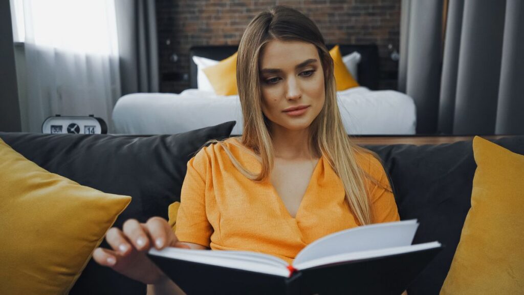 woman in yellow reading