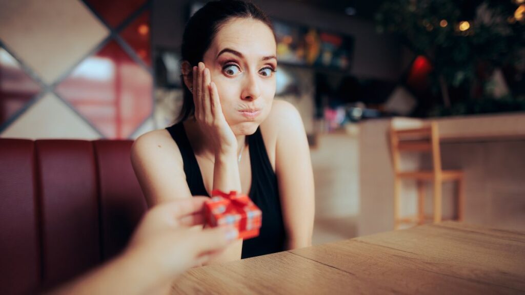 woman looking frustrated at gift